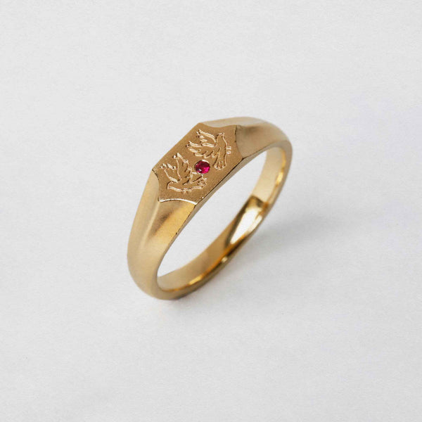 Two birds and a ruby stone on a 22CT gold vermeil signet ringTwo birds and a ruby stone on a 22CT gold vermeil signet ring