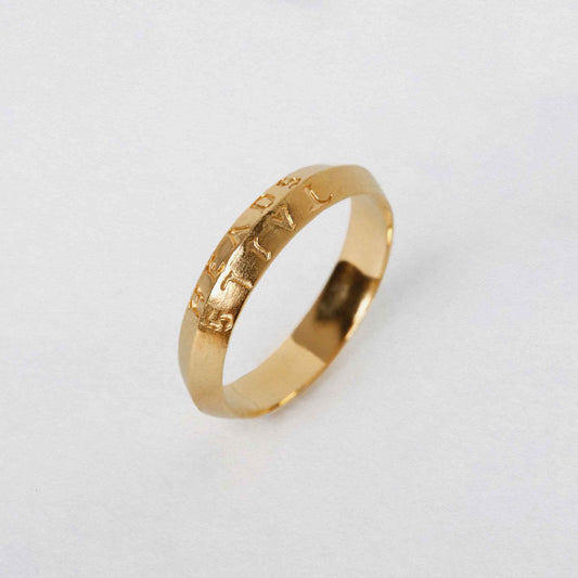 heads + tails engraved on a 22CT gold vermeil band ring