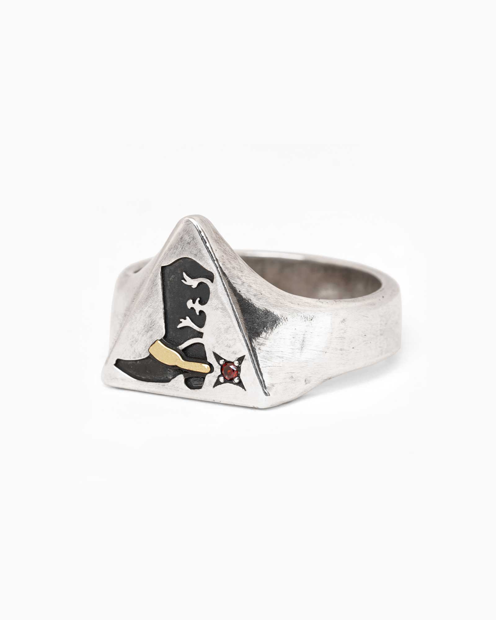 Silver ring with a cowboy boot and triangle design on a white background