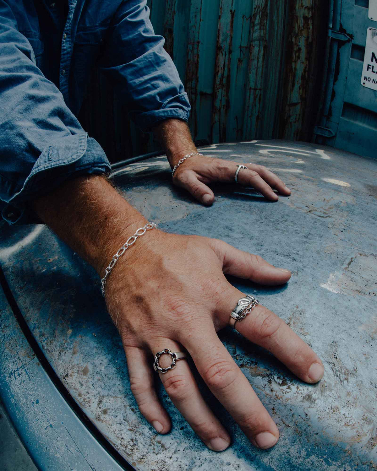 Close-up of the Loose Ends ring worn on the hand