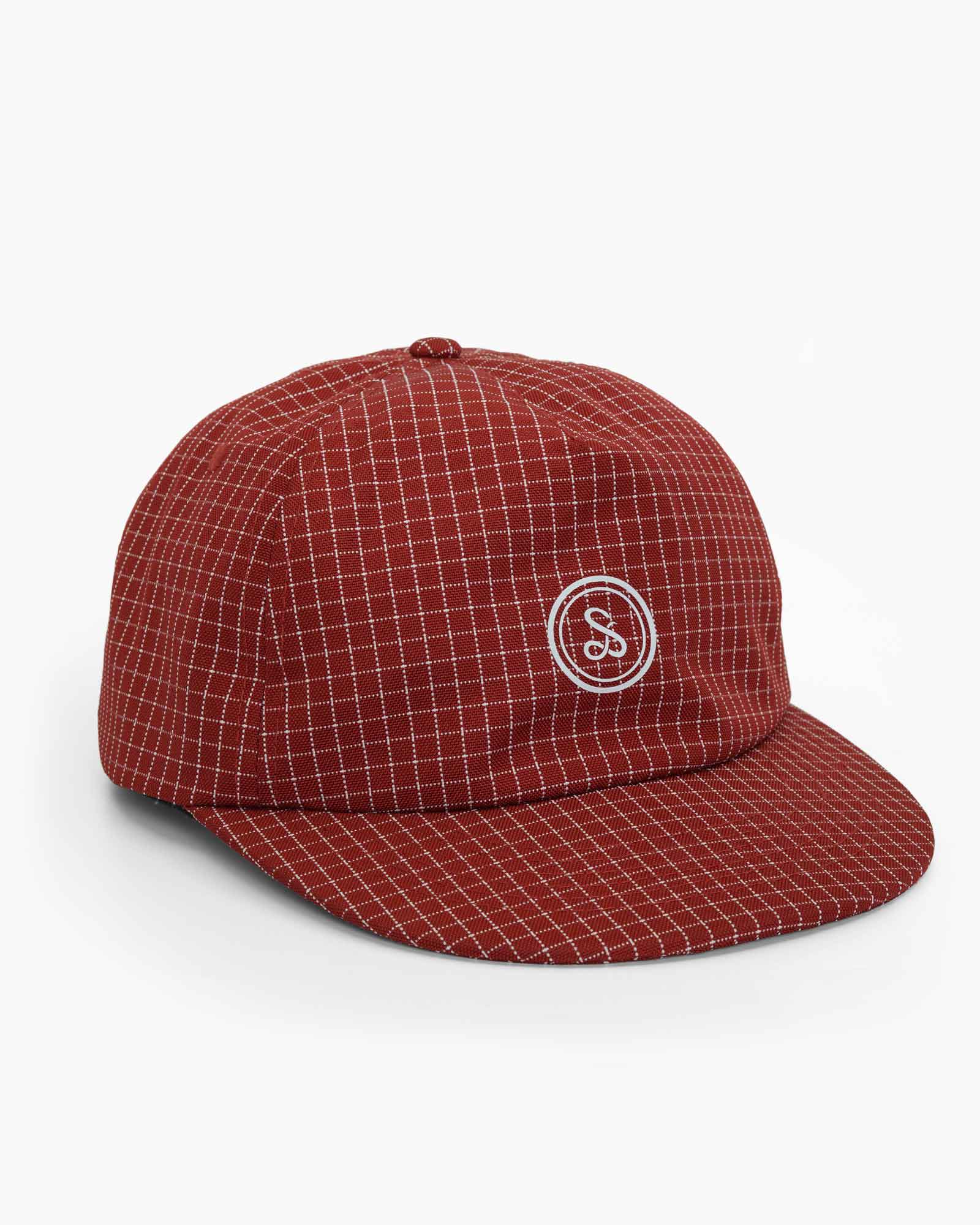 Red checkered cap on a plain white background