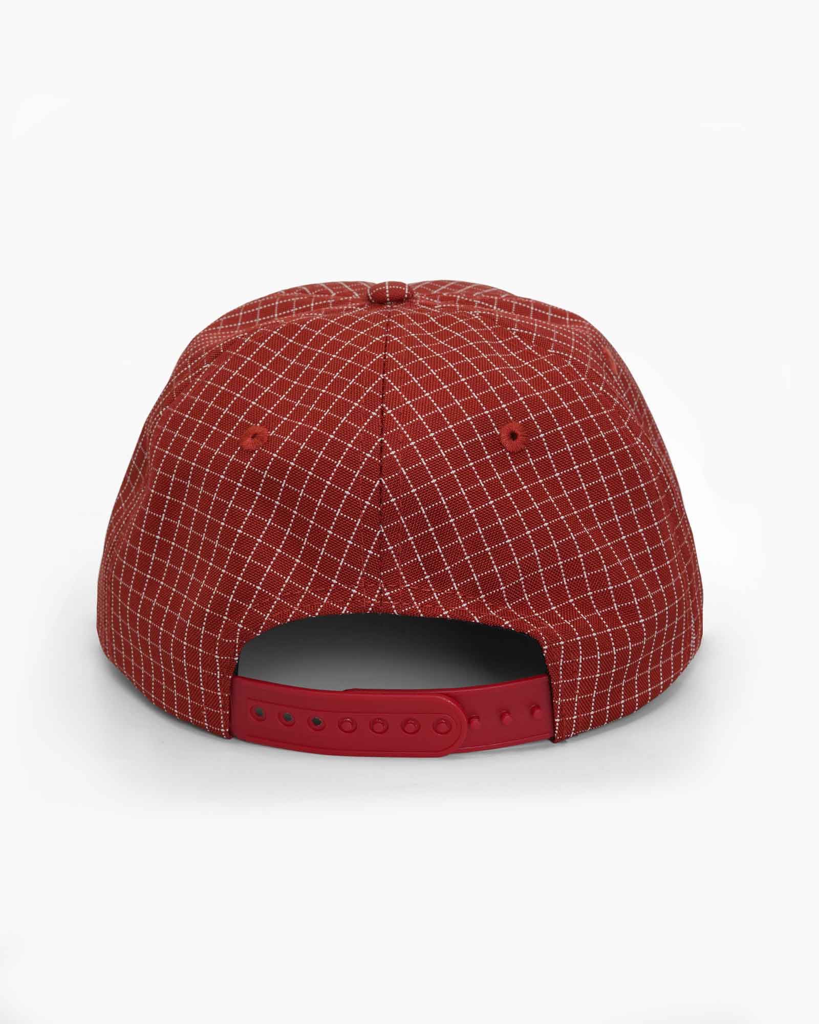 Back of a red checkered cap on a plain white background