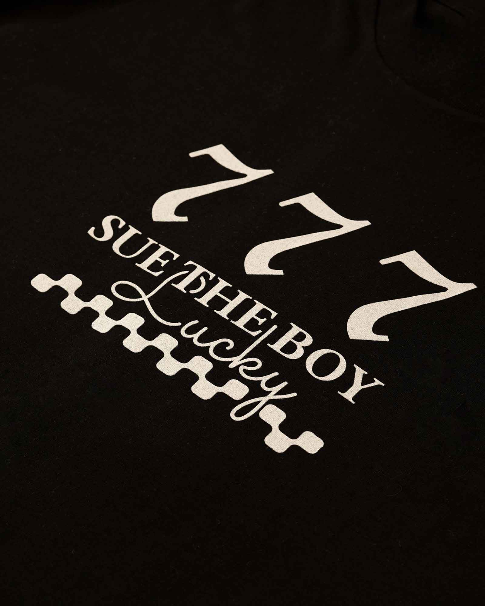 Black t-shirt with white text and design on a dark background