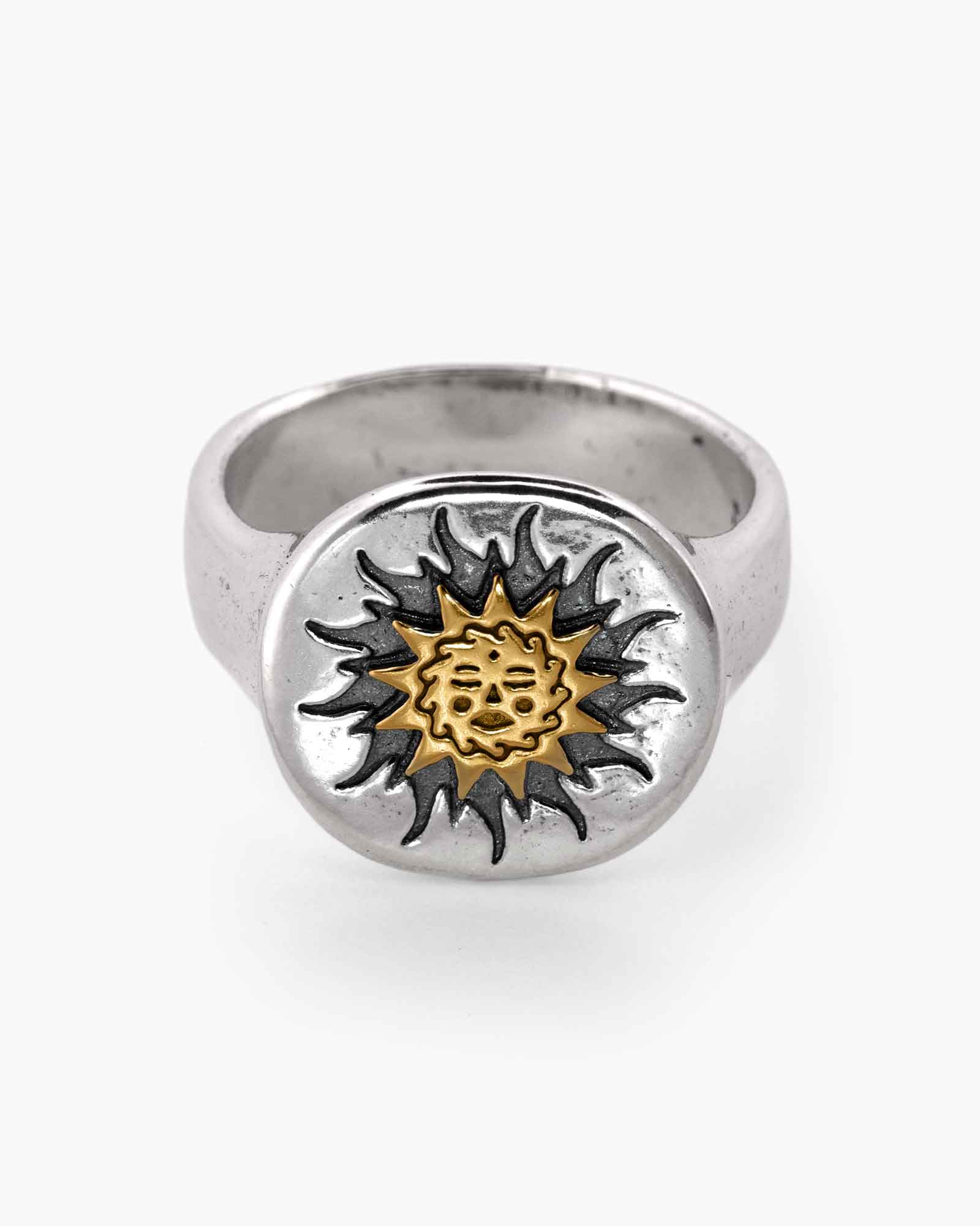 Silver ring with a sunflower design on a white background