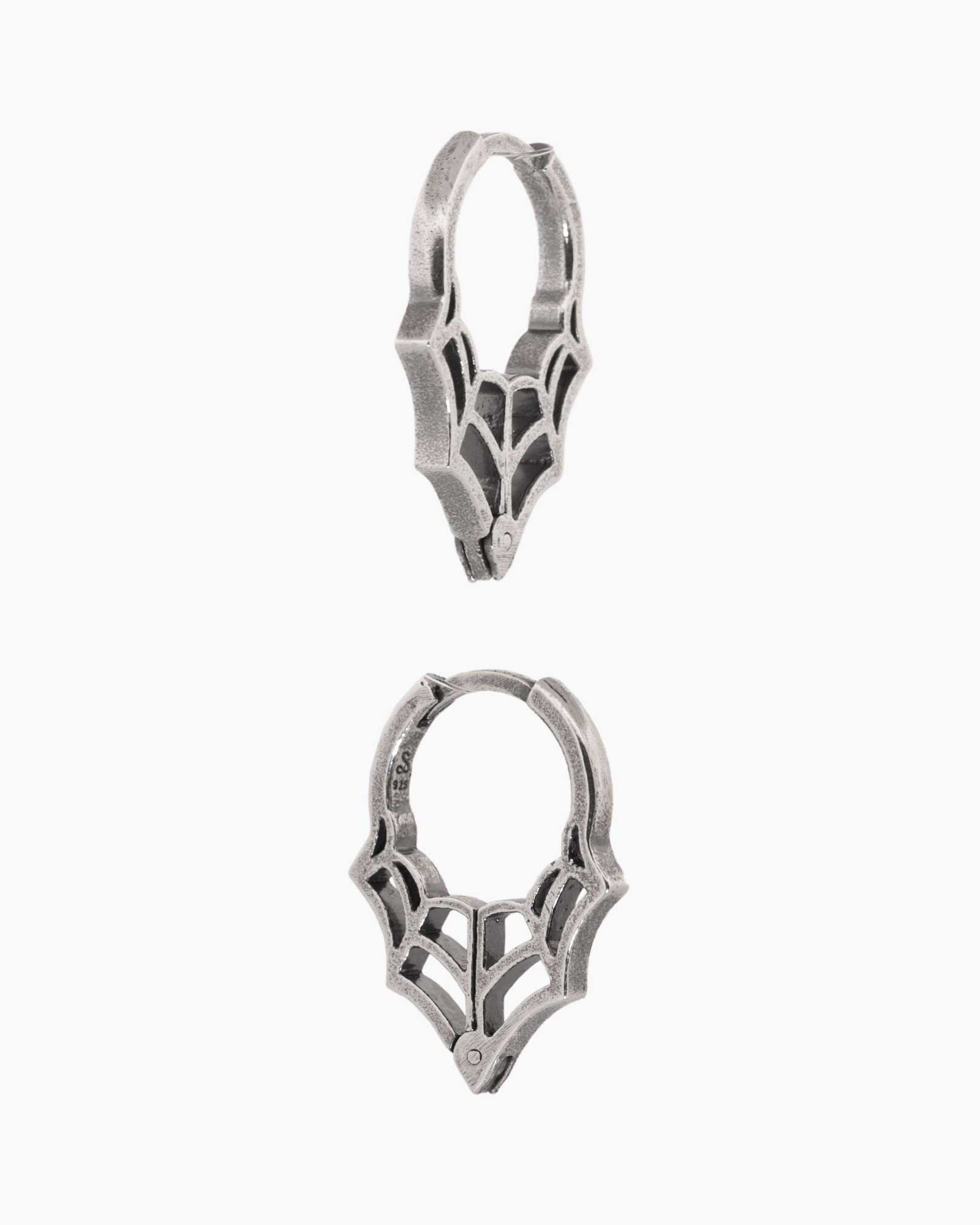 Pair of silver hoop earrings on a white background