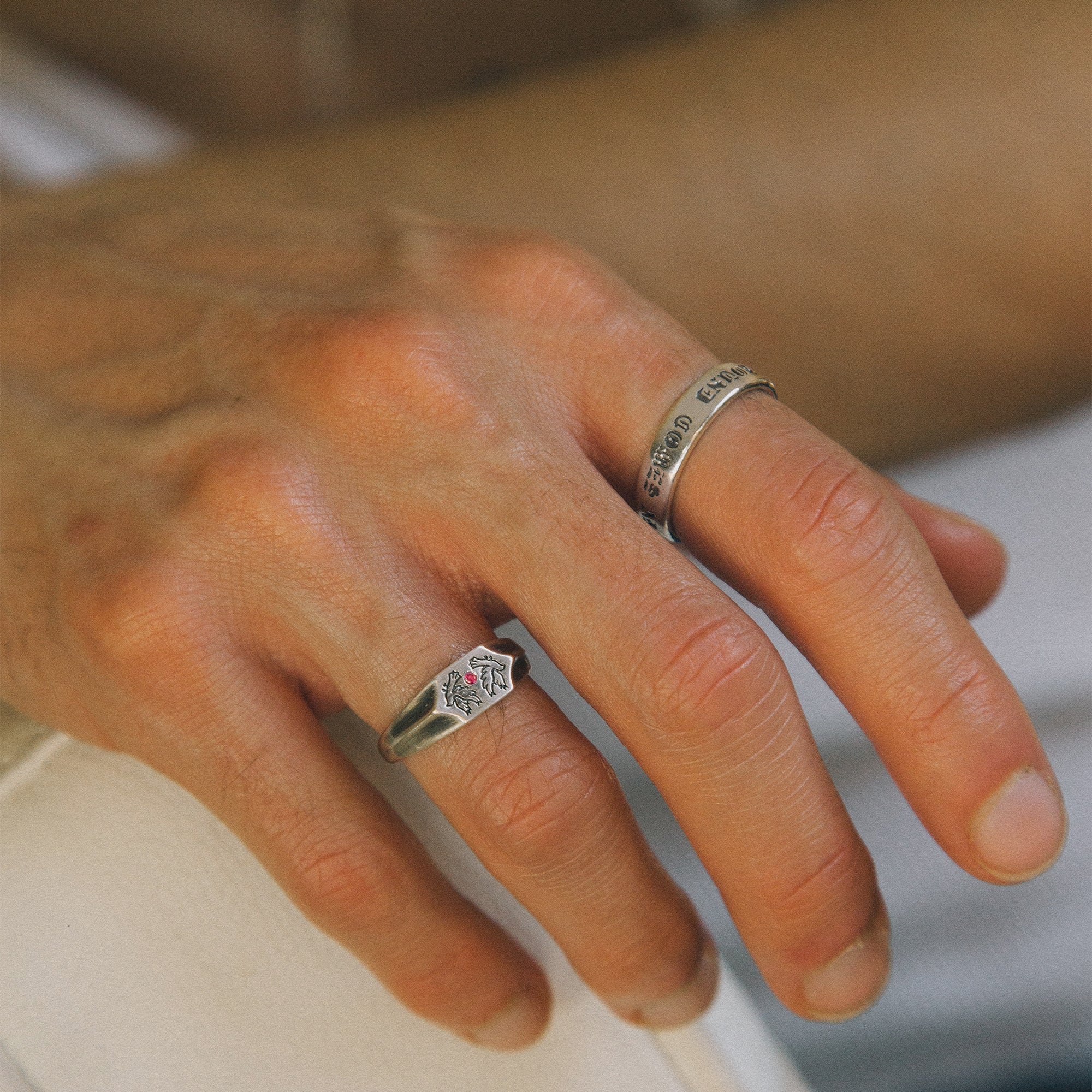 Two birds and a ruby stone on a 925 silver signet ring