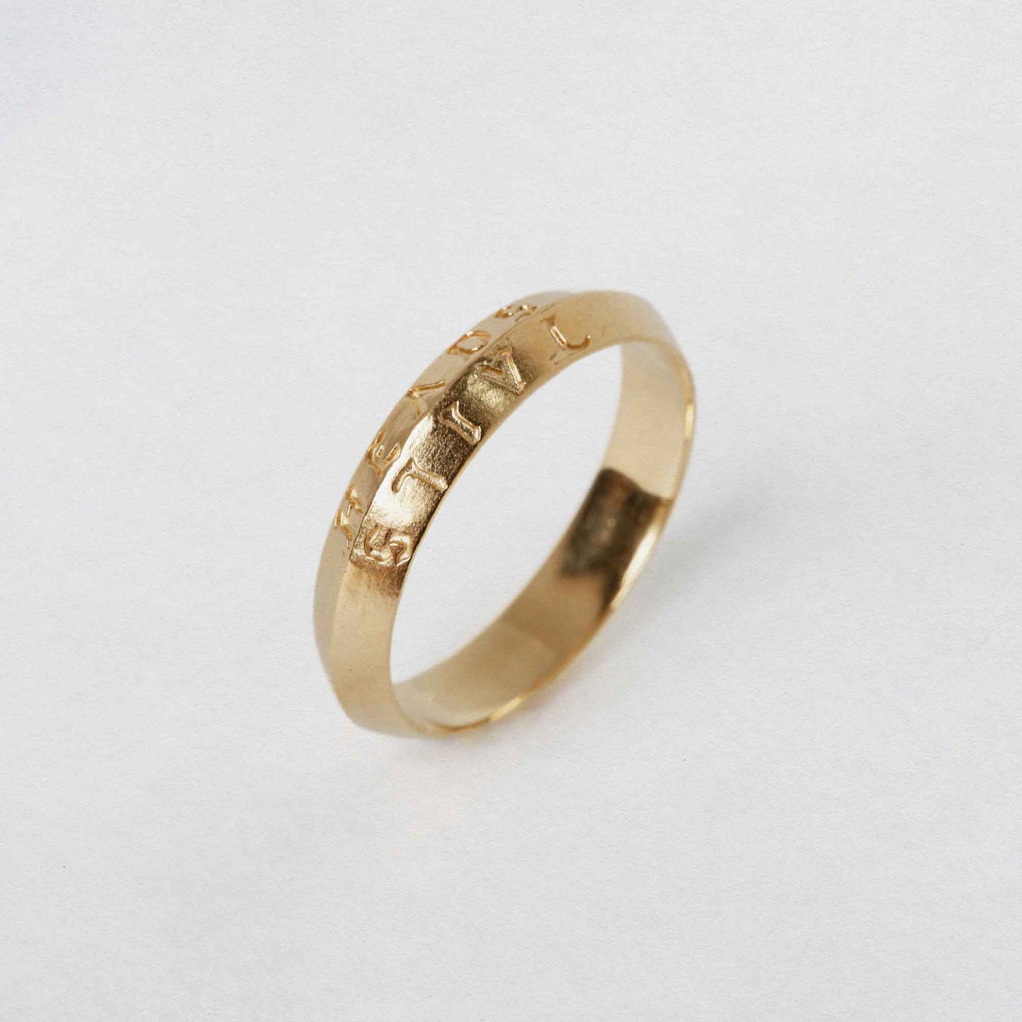 heads + tails engraved on a 9CT solid gold band ring