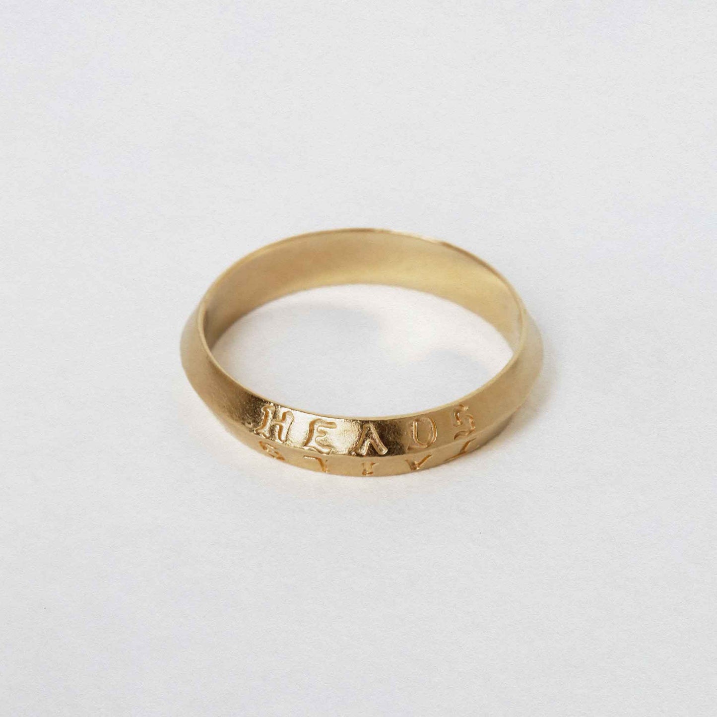 heads + tails engraved on a 9CT solid gold band ring