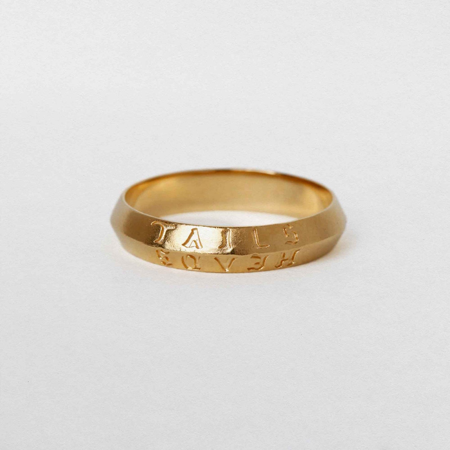 heads + tails engraved on a 22CT gold vermeil band ring