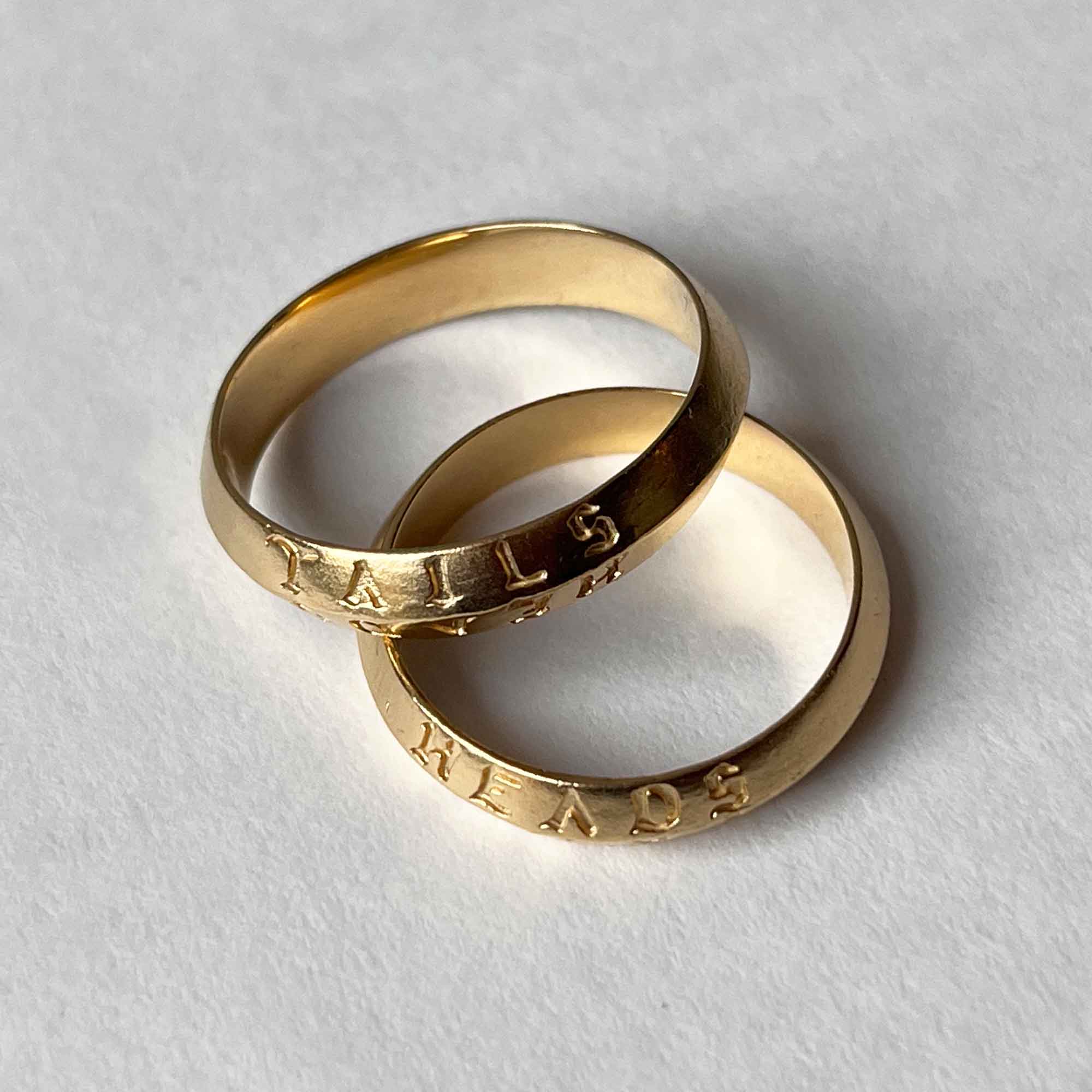 heads + tails engraved on a 22CT gold vermeil band ring