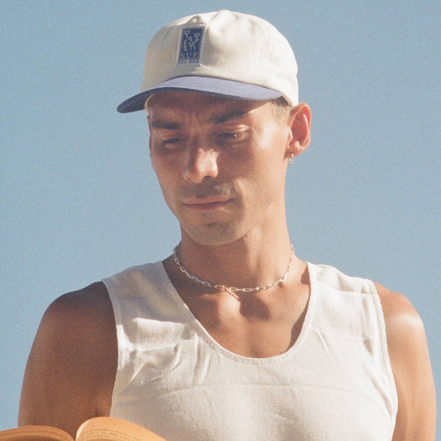 White Hat With Blue Brim & Blue Flower Patch