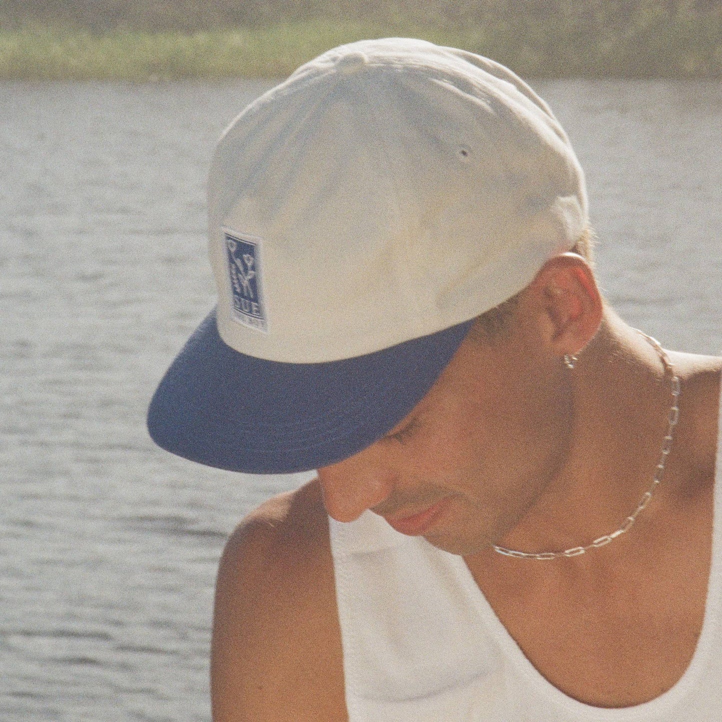 White Hat With Blue Brim & Blue Patch