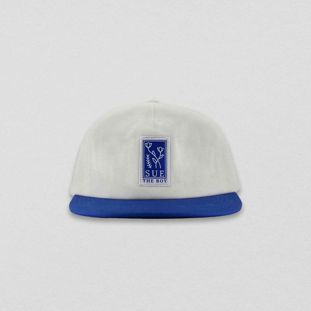  White 5-Panel Cap With A Royal Blue Brim & Blue Woven Flower Patch