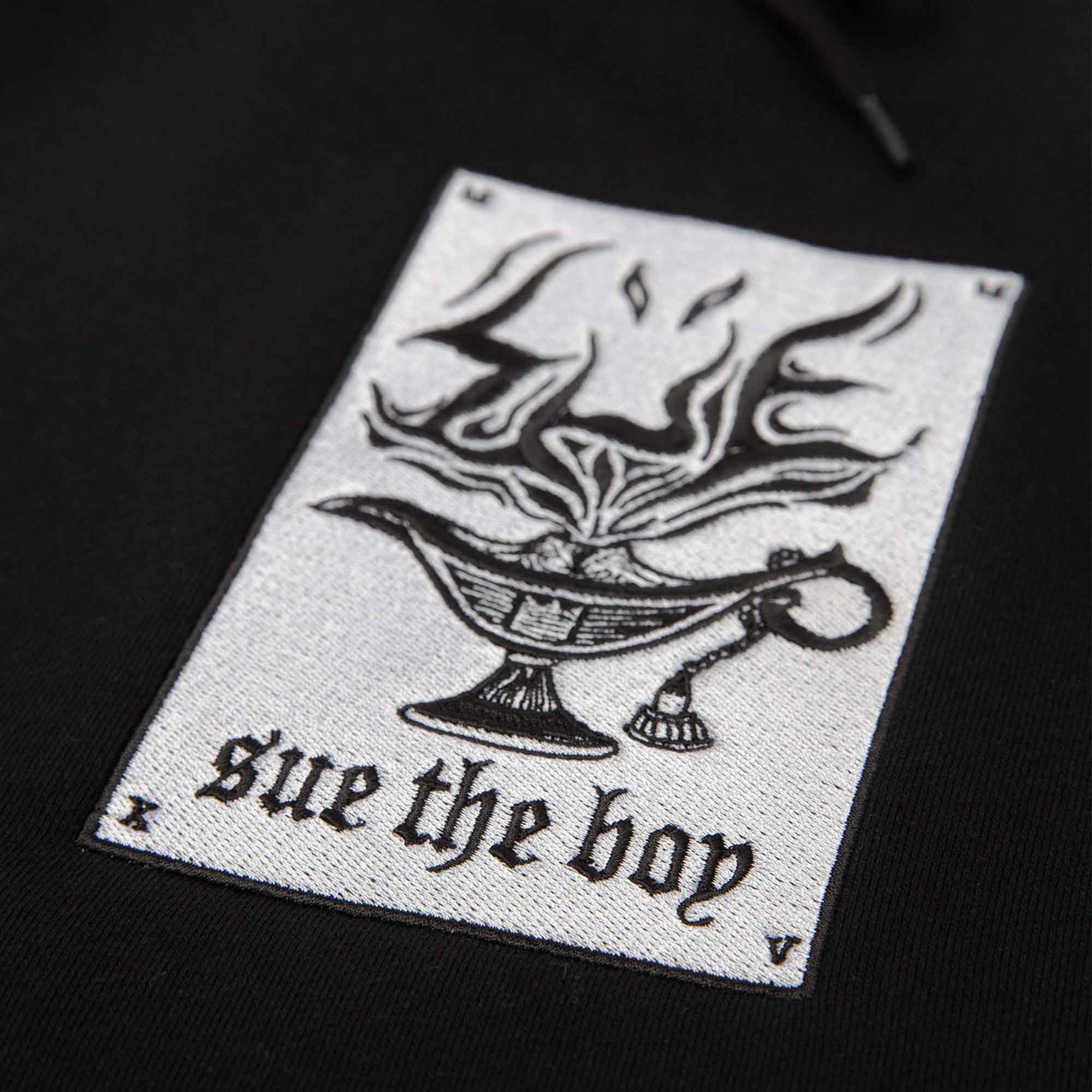 Mens Black Hoodie With White Woven Sue The Boy Patch